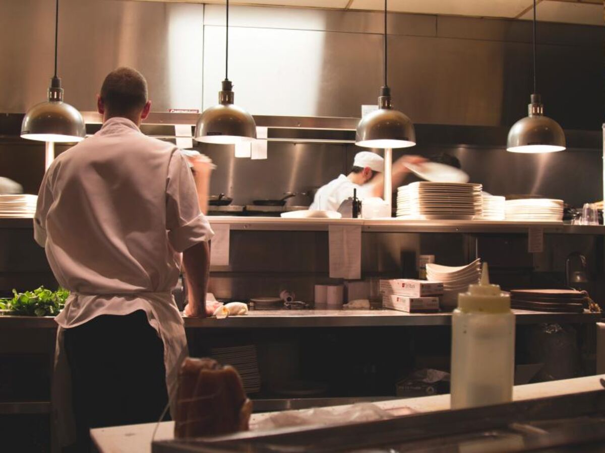 A chef working the line in a busy restaurant kitchen